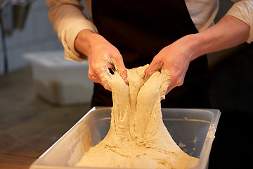 Image showing chef or baker cooking dough at bakery