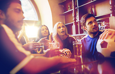 Image showing fans or friends watching football at sport bar