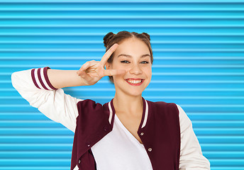 Image showing happy smiling teenage girl showing peace sign