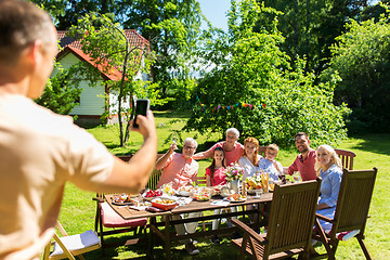 Image showing happy family photographing by smartphone in summer