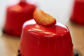 Image showing close up of mirror glaze cake at confectionery