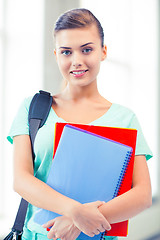 Image showing student girl with school bag and notebooks