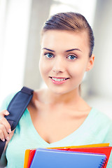 Image showing student girl with school bag and color folders