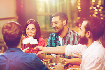 Image showing friends dining and drinking beer at restaurant