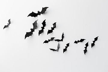 Image showing black paper bats over white background