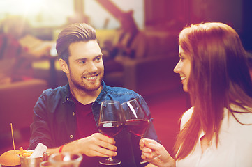 Image showing couple dining and drinking wine at restaurant