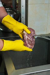 Image showing washing and cleaning meat