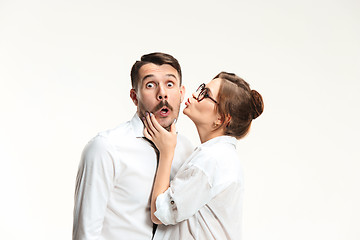 Image showing The business man and woman communicating on a gray background