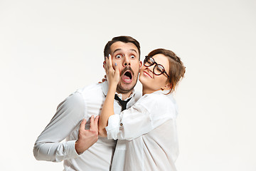 Image showing The business man and woman communicating on a gray background