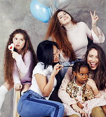 Image showing Lifestyle and people concept: young pretty diversity nations woman with different age children celebrating on birth day party together happy smiling, making selfie. African-american, asian and caucasi