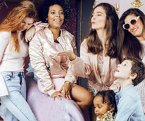 Image showing Lifestyle and people concept: young pretty diversity nations woman with different age children celebrating on birth day party together happy smiling, making selfie. African-american, asian and caucasi