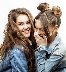 Image showing best friends teenage girls together having fun, posing emotional on white background, besties happy smiling, lifestyle people concept close up