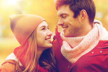 Image showing close up of happy couple walking in autumn park