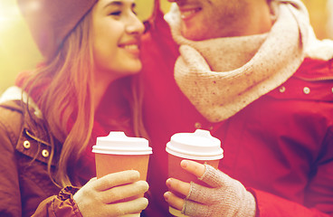 Image showing close up of happy couple with coffee in autumn