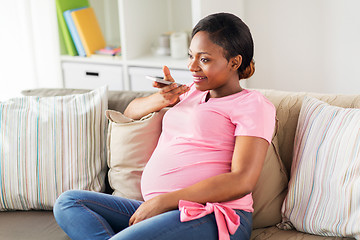 Image showing pregnant woman using voice recorder on smartphone