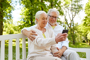 Image showing senior couple with smartphone taking selfie 