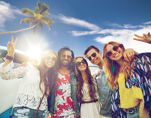 Image showing hippie friends at minivan car showing peace sign