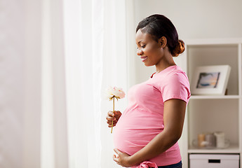 Image showing happy african american pregnant woman with flower