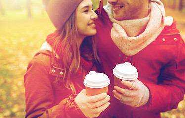 Image showing close up of happy couple with coffee in autumn