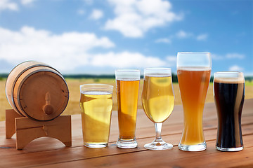 Image showing different types of beer in glasses on table