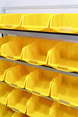 Image showing Yellow plastic racks