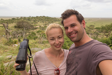 Image showing Adult couple taking selfie on african wildlife safari in Serengeti national park, Tanzania, Africa.