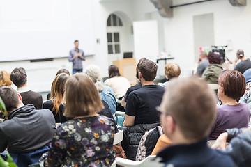 Image showing Man giving presentation in lecture hall at university.