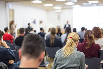 Image showing Man giving presentation in lecture hall at university.