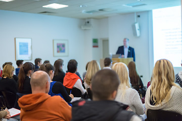 Image showing Man giving presentation in lecture hall at university.