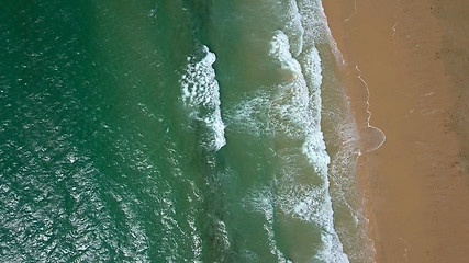 Image showing Splashing water washing sand