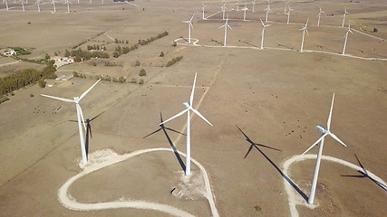 Image showing Windmills producing electricity in desert