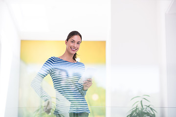 Image showing young woman at home websurfing