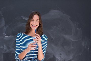 Image showing woman holding a internet cable in front of chalk drawing board