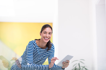 Image showing young woman at home websurfing