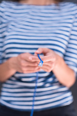 Image showing woman holding a internet cable in front of chalk drawing board