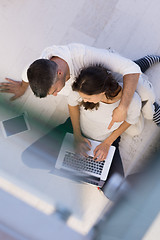 Image showing couple using tablet and laptop computers top view