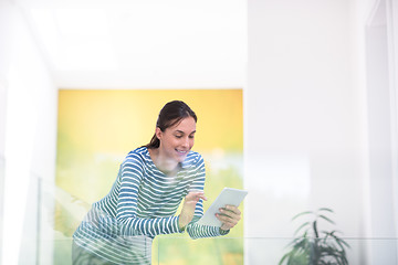 Image showing young woman at home websurfing