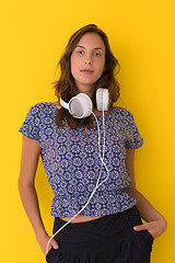 Image showing woman with headphones isolated on a yellow