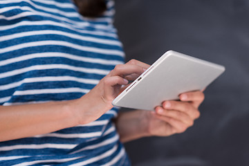 Image showing woman using tablet  in front of chalk drawing board