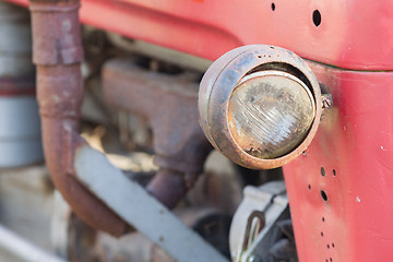 Image showing Old tractor face, selective focus on it\'s light