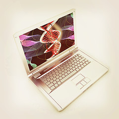 Image showing Laptop with dna medical model background on laptop screen. 3d il