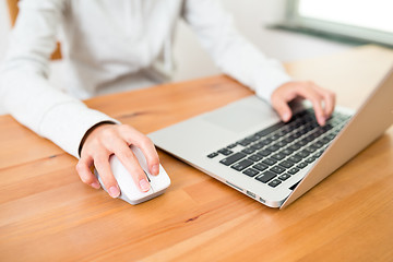 Image showing Woman using notebook computer at home