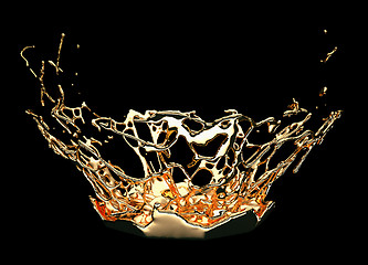 Image showing Liquid gold or oil splashes isolated on black