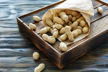 Image showing Paper bag with unshelled peanuts.