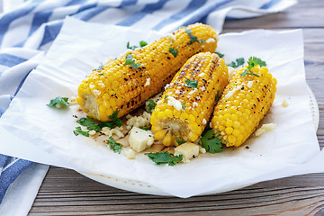 Image showing Sweet corn grilled with cheese and cilantro.