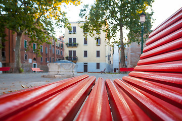Image showing Venice from a red bench