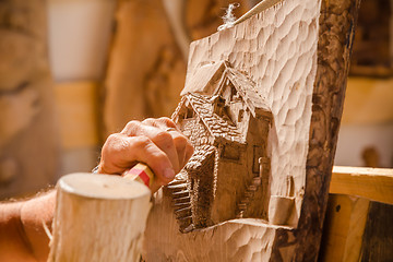 Image showing Sculptor hands working wood