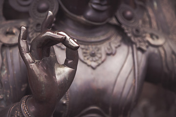 Image showing Detail of Buddha statue with Karana mudra hand position