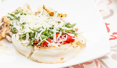 Image showing Cuttlefish with tomato, salad and Parmigiano cheese