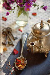 Image showing Dry tea leaves on spoon